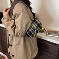 Black and white plaid chain shoulder bag with gold ring and tassel decoration - Black