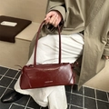 Chic burgundy faux leather underarm bag with side bow detail and stylish lettering - Red