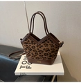Close-up of leopard print crossbody bag with V-shaped opening and brown leather trim - Leopard Coffee Color Without Charms