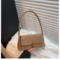 Detail of vintage khaki underarm bag featuring a gold buckle and textured faux leather - Khaki