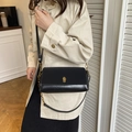 Minimalist black leather crossbody bag with golden twist lock and chain strap detail - Black