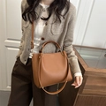 Women's brown pebbled leather tote bag with gold metal handles and shoulder strap - Brown