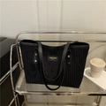 Large black corduroy tote bag with long shoulder straps and minimalist branding - Black