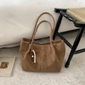 Brown suede tote bag with decorative wooden beads on a plush interior setting - Brown No Pendant