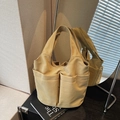 Sac seau minimaliste en nylon kaki avec quatre poches extérieures pour usage quotidien - Kaki