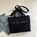 Black corduroy tote bag with white TOTE BAG embroidery and adjustable shoulder strap - Black