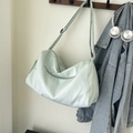 Light green mint gym bag made of waterproof nylon with adjustable black shoulder strap - Green