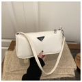 White nylon baguette shoulder bag with a black triangular metal logo and slim strap - White