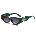 Retro dark green cat eye sunglasses with red trim and golden logo in a 45-degree side view - Regular / Green Frame Green Grey Lens