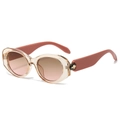 Oval cat-eye sunglasses with champagne resin frame and gradient lenses in 45-degree view - Tea Frame Tea Pink Lens