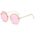 Fashionable rimless round sunglasses with pink lenses and a sleek gold metal frame - Gold Frame Purple Lens