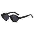 Retro oval cat-eye sunglasses with glossy black frames and dark lenses in 45-degree view - Black Frame Black Grey Lens
