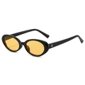 Lunettes de soleil ovales rétro avec monture noire et verres jaunes en vue de profil - Monture Noire Verres Orange Jaune