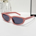 Chic cat-eye sunglasses with glossy pink frames and dark lenses in 45-degree view - Pink Frame Grey Lens