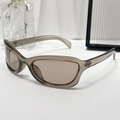 Occhiali da sole ovali chic con montatura ambra traslucida e lenti polarizzate marrone scuro - Montatura Tè Trasparente Lenti Champagne