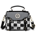 Retro black and white checkered crossbody bag with gold clover buckle and top handle - Black
