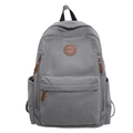 Minimalist grey corduroy backpack with front pocket and durable brown leather zipper pullers - Gray