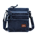 Detalle de bolso bandolera vaquero azul con cremalleras y parche de cuero café - Azul oscuro