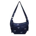 Dark blue denim crossbody bag featuring white bow patterns and adjustable strap - Dark Blue