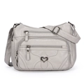 Sac bandoulière gris clair en cuir souple avec fermeture éclair et pendentif cœur - Gris