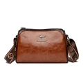 Brown oil wax leather pillow bag with a floral wide strap and kangaroo metal logo - Brown