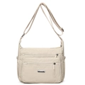Sac bandoulière en nylon beige avec plusieurs poches zippées et bandoulière réglable - Blanc Cassé