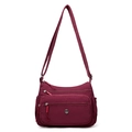 Sac bandoulière bordeaux en nylon imperméable avec plusieurs poches et sangle réglable - Bordeaux