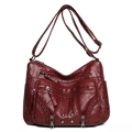 Dark red multi-pocket faux leather crossbody bag with rivet accents and braided details - Red