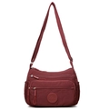 Waterproof burgundy nylon crossbody bag with multiple zip pockets and adjustable strap - Red