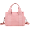 Pink canvas tote bag with adjustable shoulder strap and front pocket in a minimalist design - Pink