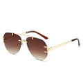 Goldene Pilotenbrille mit braunen Verlaufsgläsern und verzierten geometrischen Details - Goldener Rahmen Verlaufs-Tee-Gläser