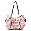Rosa Vintage-Tragetasche mit schwarzem Kronen-Grafik und Ketten-Griffen im Retro-Stil - Rosa
