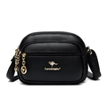 Black pebbled leather crossbody bag featuring gold kangaroo logo and multi-zipper design - Black