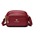 Burgundy crossbody bag in lychee texture synthetic leather with gold metal hardware - Red