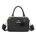 Black crocodile embossed cylinder bag with gold kangaroo logo and wide woven strap - Black
