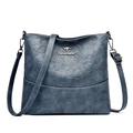 Dark blue leather bucket bag with embossed four-leaf clover patterns and adjustable strap - Blue