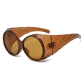 Retro amber wrap-around sunglasses featuring thick striped frames and brown lenses - Tea Frame Tea Lens