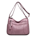 Sac à bandoulière rose lotus en cuir souple avec plusieurs poches zippées pratiques - Rose