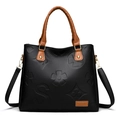 Borsa da donna in pelle martellata nera con manici marroni e goffratura floreale - Marrone