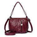 Burgundy PU leather bucket bag with pleated texture and adjustable crossbody strap - Red