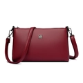 Minimalist wine red crossbody bag in lychee textured faux leather with silver geometric logo - Burgundy