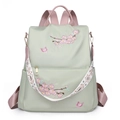 Zaino da donna in nylon verde salvia con ricamo di ciliegio e tracolla intrecciata - Verde