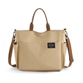 Beigefarbene Canvas-Einkaufstasche mit braunem Gurt und mehreren Außentaschen - Khaki