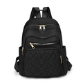 Schwarzer gesteppter Damenrucksack aus Nylon mit goldenen Reißverschlüssen und viel Stauraum - Schwarz