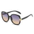 Schicke schwarze ovale Sonnenbrille mit lila-orangefarbenen Verlaufsgläsern und Goldakzenten - Schwarzer Rahmen Graubraune Gläser