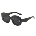 Gafas de sol ovaladas vintage con montura negra gruesa y detalles de metal dorado - Montura Negra Lentes Grises