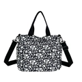 Floral canvas tote bag with black handles and adjustable wide crossbody nylon strap - Black