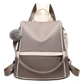 Zaino da donna in tessuto oxford talpa con finiture beige e un pompon grigio di moda - Cachi