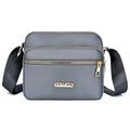Gray nylon crossbody bag with multi-compartment gold zippers and adjustable strap - Gray