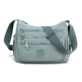 Solid color nylon crossbody bag with multi-pocket design and adjustable shoulder strap - Light Green